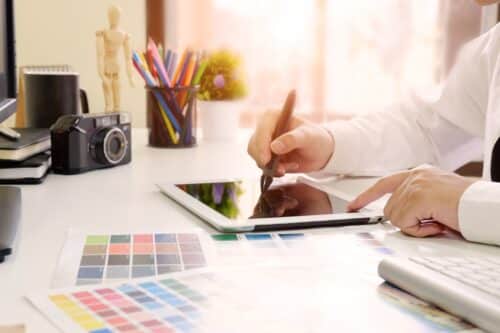 Logo 13 graphic-designer-working-with-digital-tablet-cropped-shot-photo